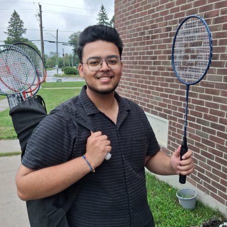 Arsh Singh with badminton rackets